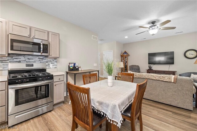 dining space featuring visible vents, ceiling fan, light wood-style flooring, and recessed lighting