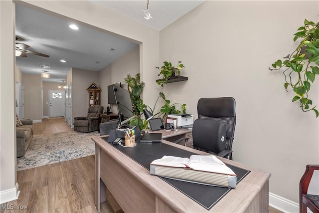 office space with wood finished floors, ceiling fan, recessed lighting, and baseboards