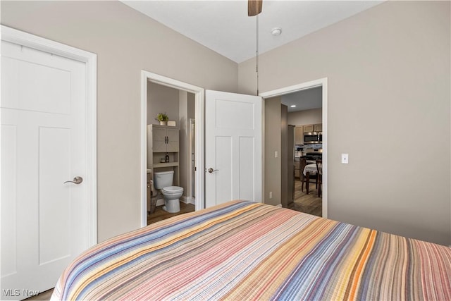 bedroom with ceiling fan and ensuite bath