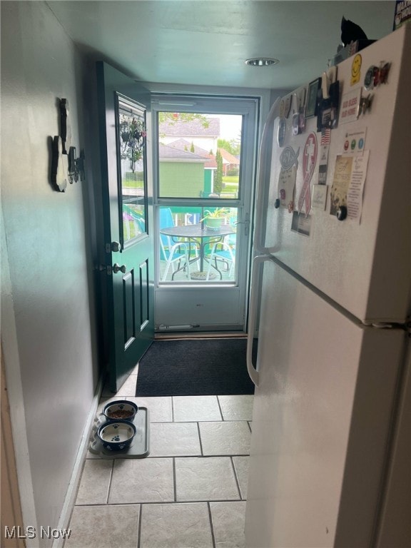 entryway with tile patterned floors