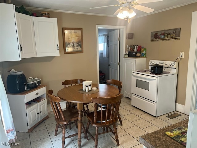 dining area featuring light tile patterned floors, a ceiling fan, and crown molding