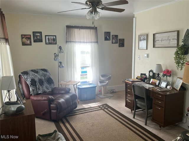 office area featuring crown molding, ceiling fan, light colored carpet, and baseboards