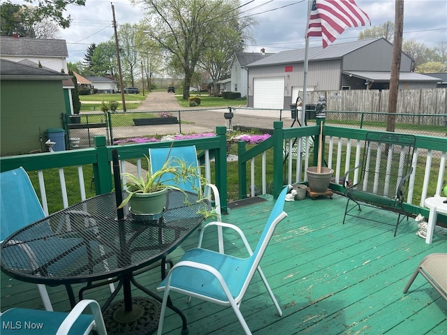 wooden deck featuring fence and a lawn