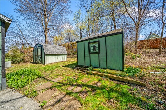1420 Bridge St, Ashtabula, OH 44004 - view of shed featuring fence