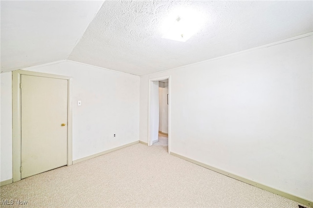 1420 Bridge St, Ashtabula, OH 44004 - bonus room featuring baseboards, light carpet, and vaulted ceiling