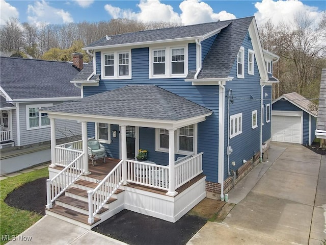 view of front of property with a garage, an outbuilding, covered porch, roof with shingles, and concrete driveway