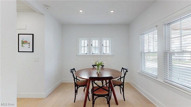 dining room with recessed lighting, light wood finished floors, and baseboards