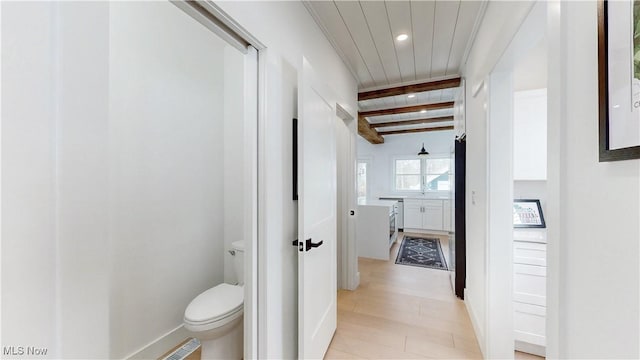 hall featuring beam ceiling, recessed lighting, baseboards, and wood ceiling