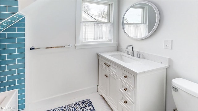 full bathroom with tile patterned floors, toilet, and vanity