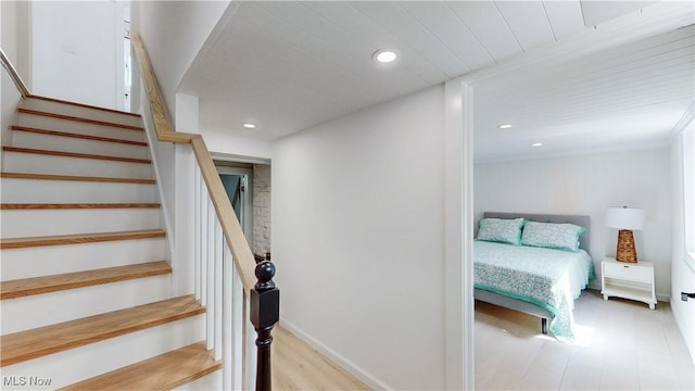 stairway featuring recessed lighting and baseboards