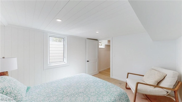 bedroom with baseboards, recessed lighting, and light wood finished floors