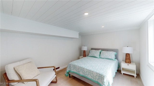 bedroom featuring recessed lighting, light wood finished floors, baseboards, and wooden ceiling