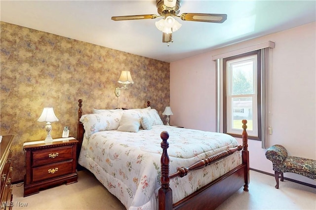 carpeted bedroom featuring ceiling fan and baseboards