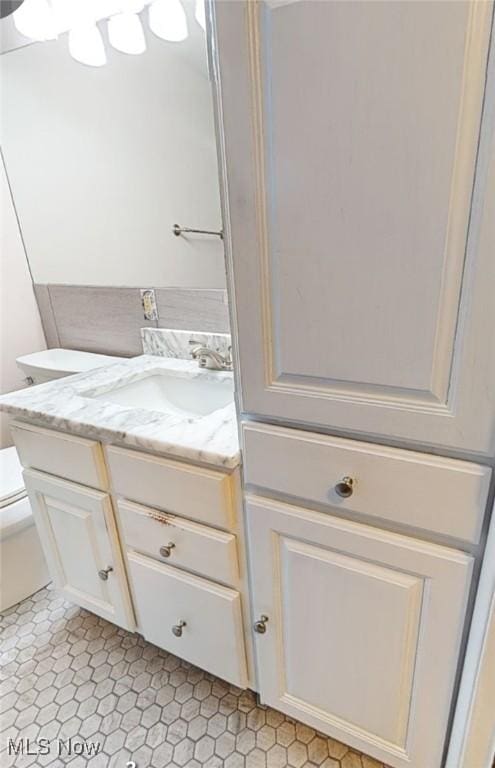 half bath with toilet and vanity