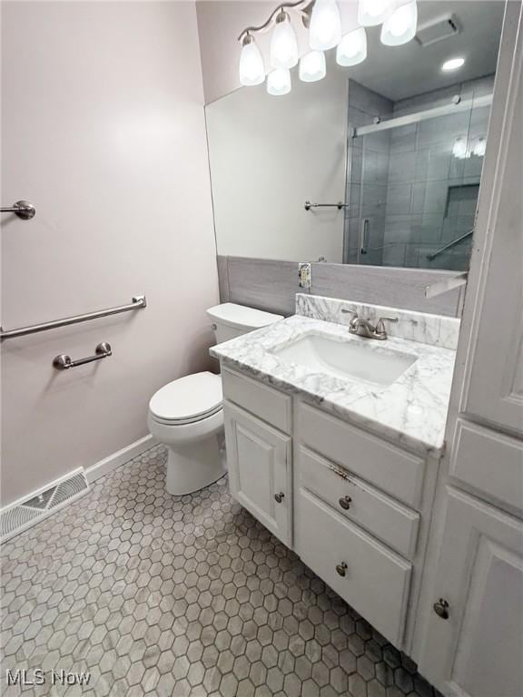 220 Bantam Ridge Ct, Wintersville, OH 43953 - bathroom featuring toilet, baseboards, visible vents, a shower stall, and vanity