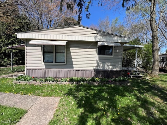 view of home's exterior with a yard