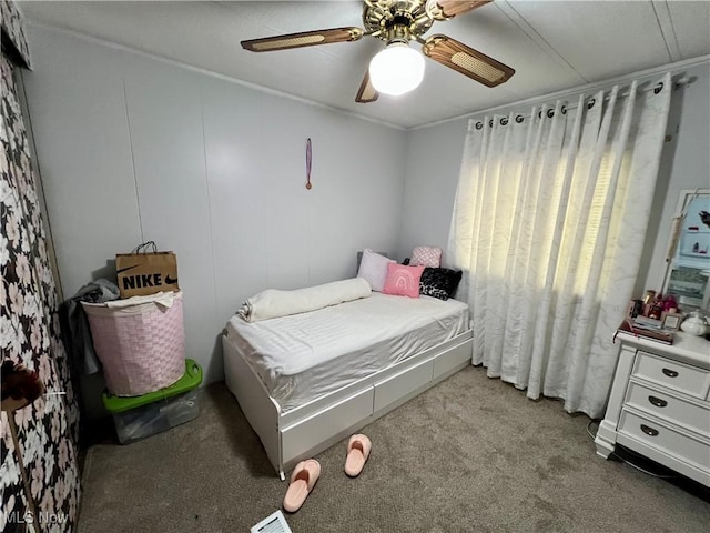 bedroom with ceiling fan and carpet
