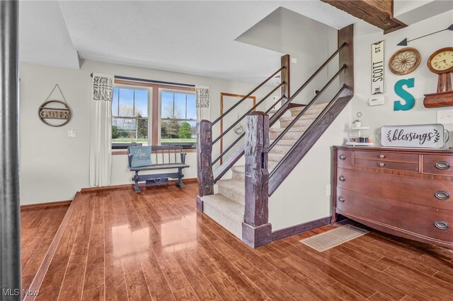 39233 Jones Rd, Litchfield, OH 44253 - stairway featuring wood finished floors and baseboards