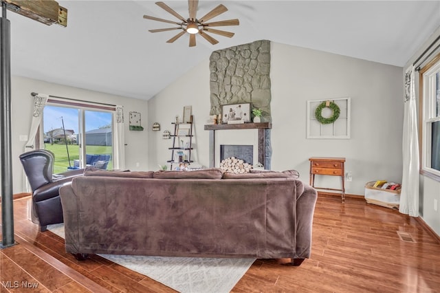39233 Jones Rd, Litchfield, OH 44253 - living area with ceiling fan, visible vents, baseboards, vaulted ceiling, and wood finished floors