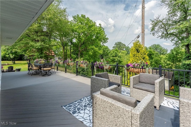 deck with outdoor dining space
