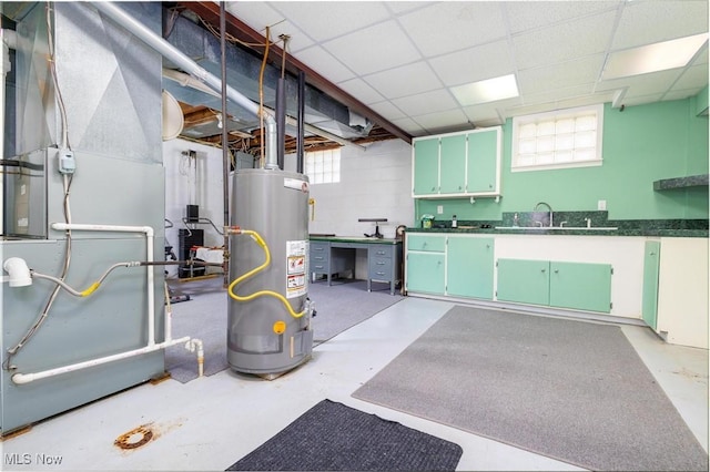265 Putnam Ln, Weirton, WV 26062 - below grade area featuring water heater, heating unit, a drop ceiling, and a sink
