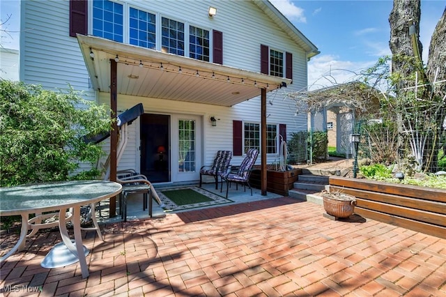 back of property featuring a patio