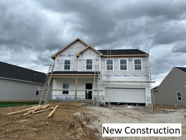 property under construction featuring a garage