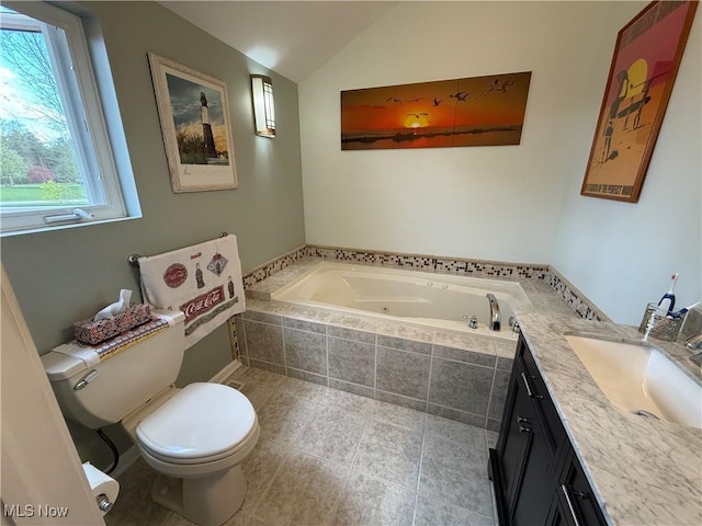 bathroom with toilet, a whirlpool tub, vaulted ceiling, and vanity
