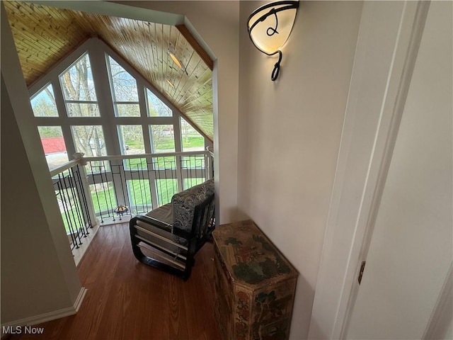 interior space featuring wooden ceiling, vaulted ceiling, and wood finished floors
