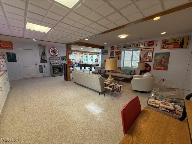 living area featuring baseboards