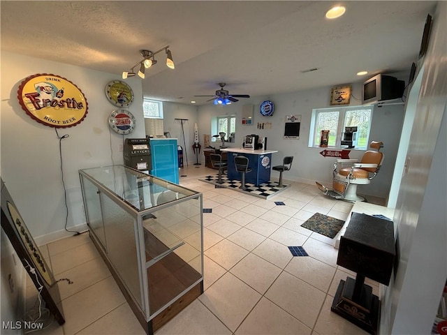 kitchen featuring recessed lighting, light tile patterned floors, light countertops, baseboards, and a ceiling fan