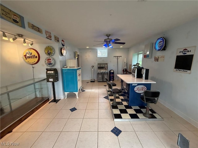 interior space featuring recessed lighting, blue cabinetry, light countertops, ceiling fan, and light tile patterned flooring