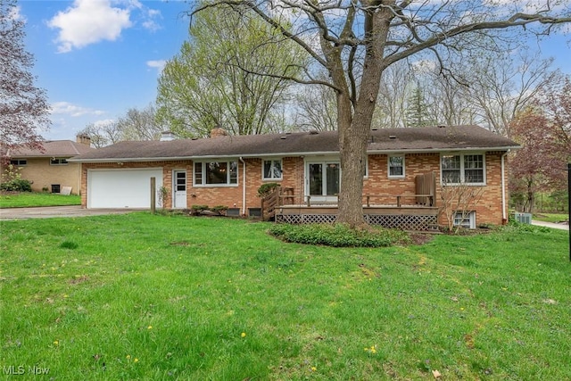 single story home with driveway, a front yard, brick siding, and a garage