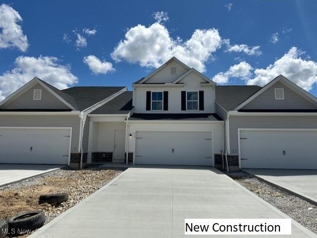 414 Honeycrisp Dr NE, Louisville, OH 44641 - view of front facade featuring driveway