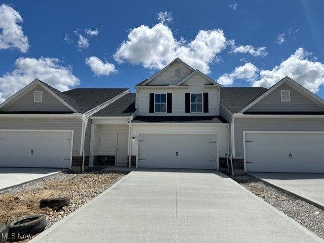414 Honeycrisp Dr NE, Louisville, OH 44641 - view of front facade with concrete driveway