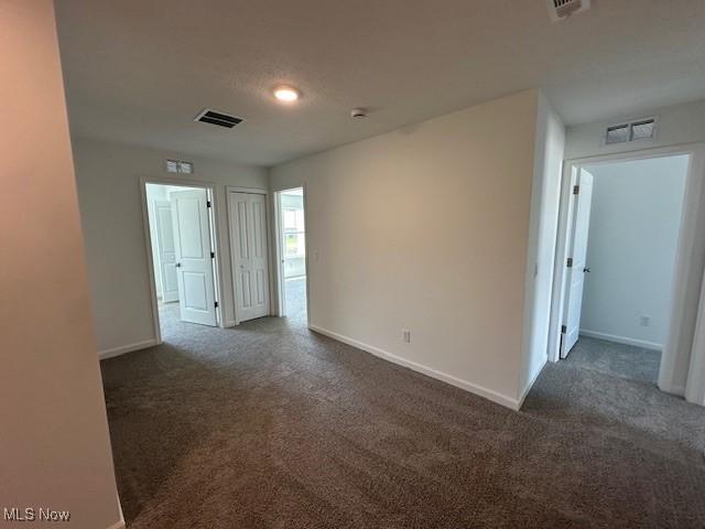 414 Honeycrisp Dr NE, Louisville, OH 44641 - unfurnished room featuring carpet floors and baseboards