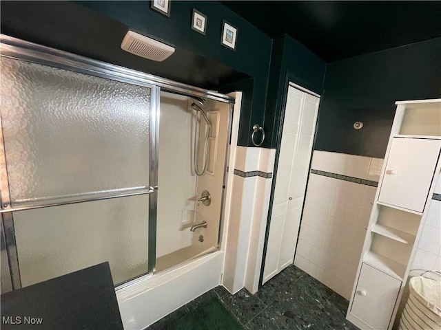 full bath featuring enclosed tub / shower combo