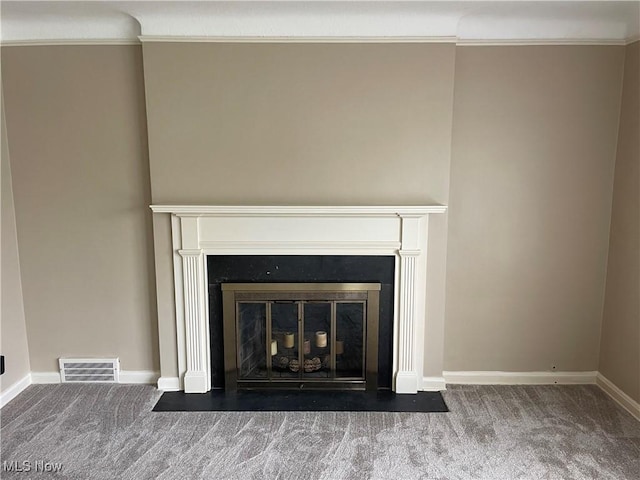 details with carpet, visible vents, and ornamental molding