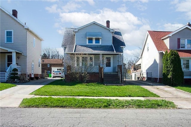 9612 Park Heights Ave, Garfield Heights, OH 44125 - view of front facade with a front yard, driveway, covered porch, and a chimney