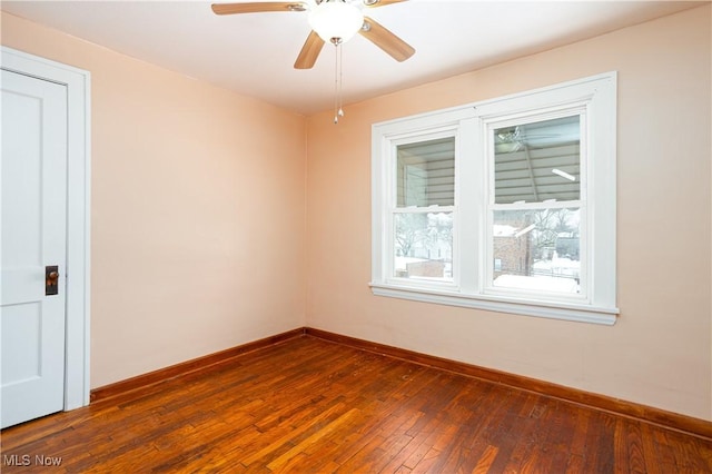 9612 Park Heights Ave, Garfield Heights, OH 44125 - unfurnished room featuring dark wood finished floors, a ceiling fan, and baseboards