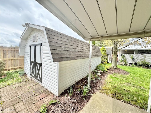 view of shed with fence