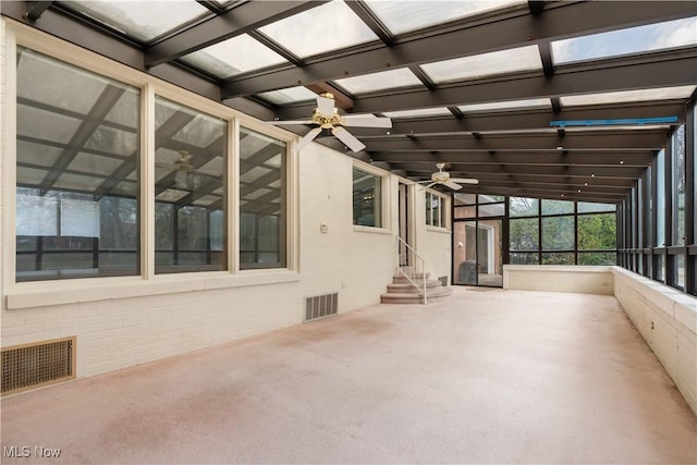 unfurnished sunroom featuring beam ceiling and visible vents