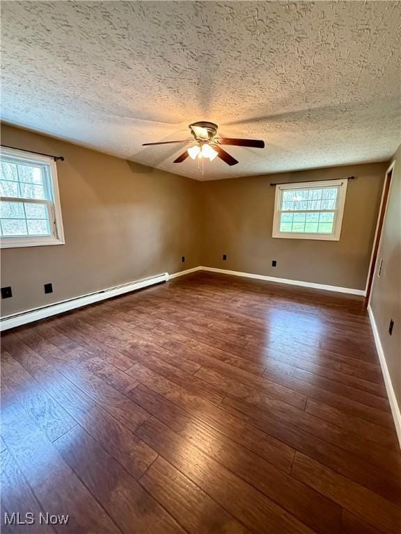 83 Oneida Trl, Malvern, OH 44644 - unfurnished room featuring baseboards, ceiling fan, a textured ceiling, and dark wood-type flooring