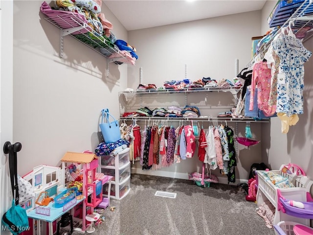 spacious closet with visible vents and carpet flooring