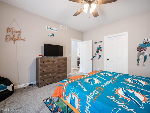 bedroom featuring visible vents, ceiling fan, baseboards, and carpet floors