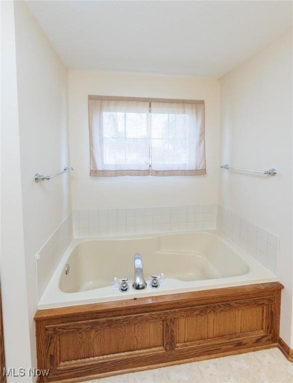 full bathroom with a bath