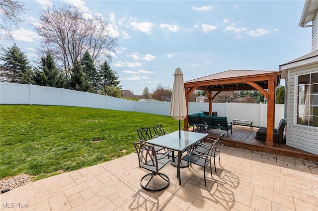view of patio / terrace with outdoor dining space, a gazebo, a deck, and a fenced backyard