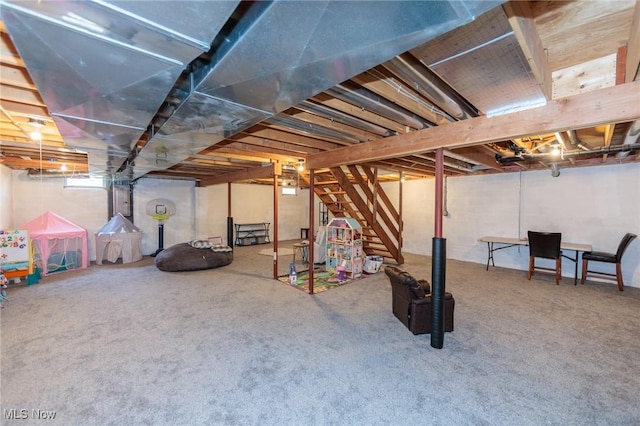 unfinished basement with stairs and carpet