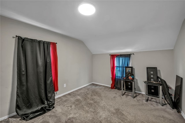 recreation room featuring carpet flooring, vaulted ceiling, and baseboards