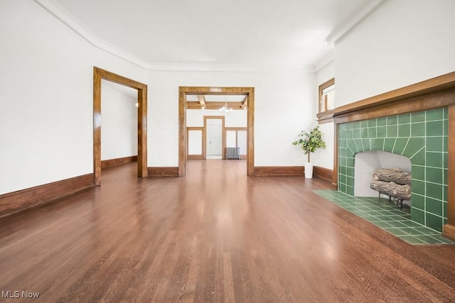 1357 E Blvd Unit 2, Cleveland, OH 44106 - unfurnished living room with baseboards, wood finished floors, a tile fireplace, and ornamental molding